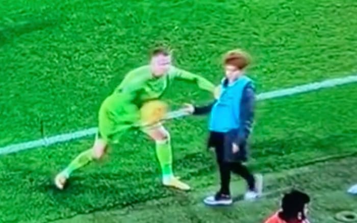 Fulham goalkeeper Bernd Leno pictured (left) pushing a Bournemouth ball boy during a Premier League game on Boxing Day in 2023